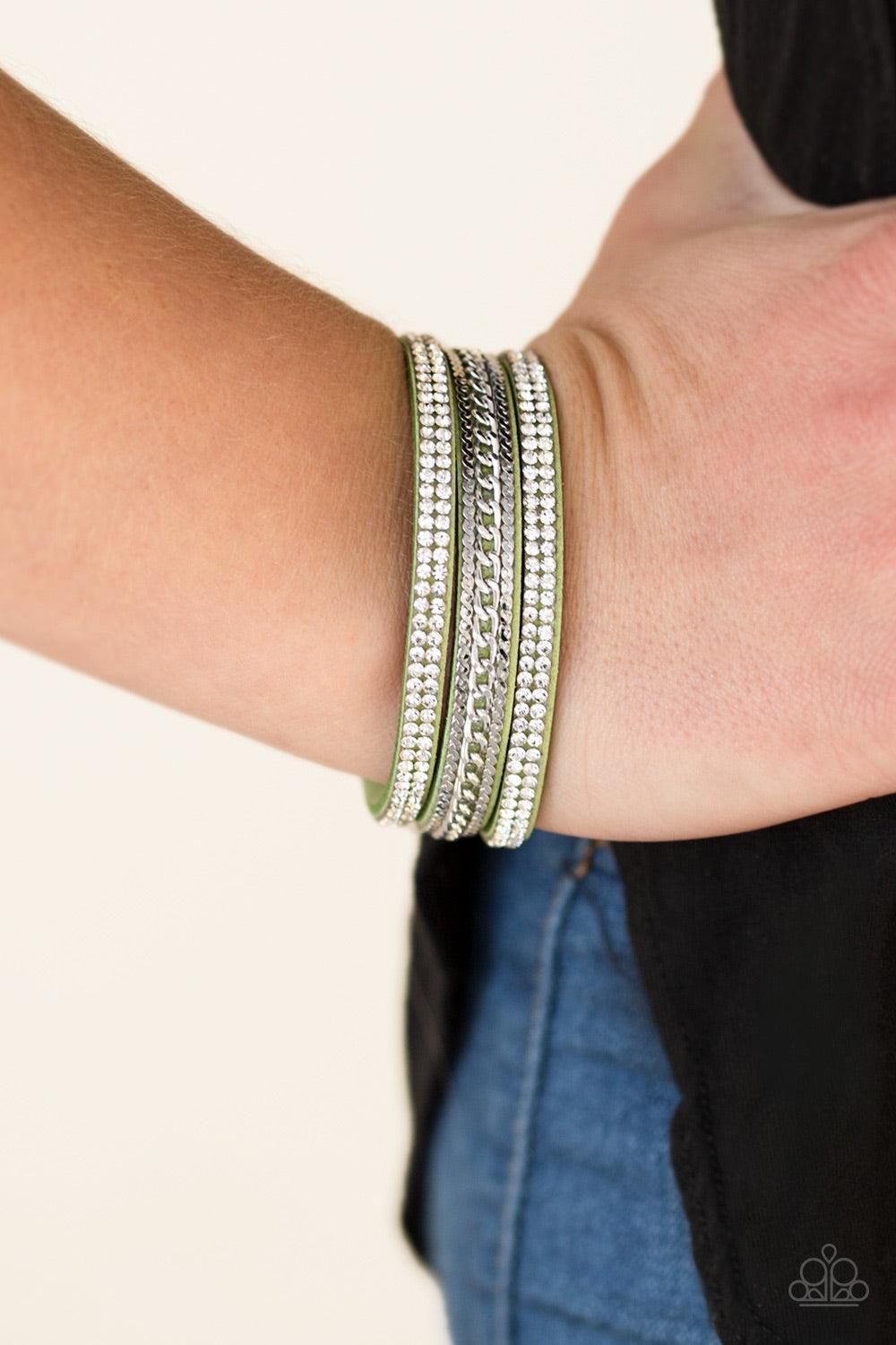 Paparazzi Accessories Unstoppable - Green Glassy white rhinestones and shimmery silver chains are encrusted along strands of green suede, creating a mishmash of sassy shimmer around the wrist for a fierce look. Features an adjustable snap closure. Bracele