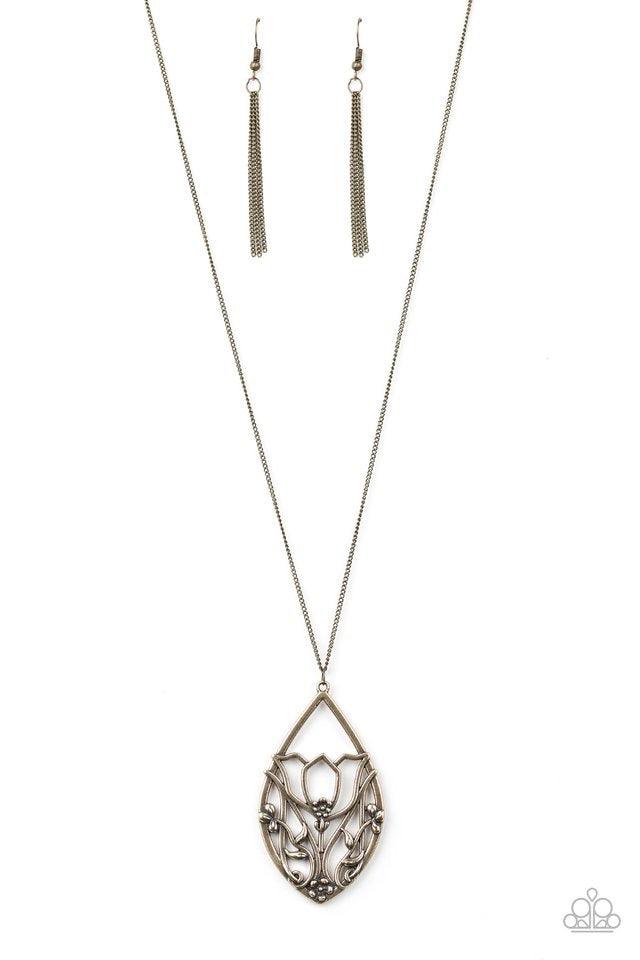 Paparazzi Accessories Eden Enchantment - Brass Dotted with dainty flower accents, glistening brass filigree blooms across a teardrop frame, coalescing into a beautiful floral pendant. Features an adjustable clasp closure. Jewelry