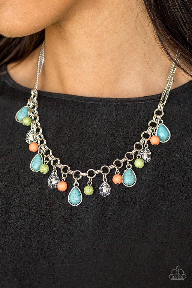 Paparazzi Accessories Welcome to Bedrock ~Multi Chiseled into round and teardrop shapes, refreshing turquoise, green, and orange stones swing from the bottom of a bold double-linked silver chain below the collar. Embossed in studded details, shimmery silv