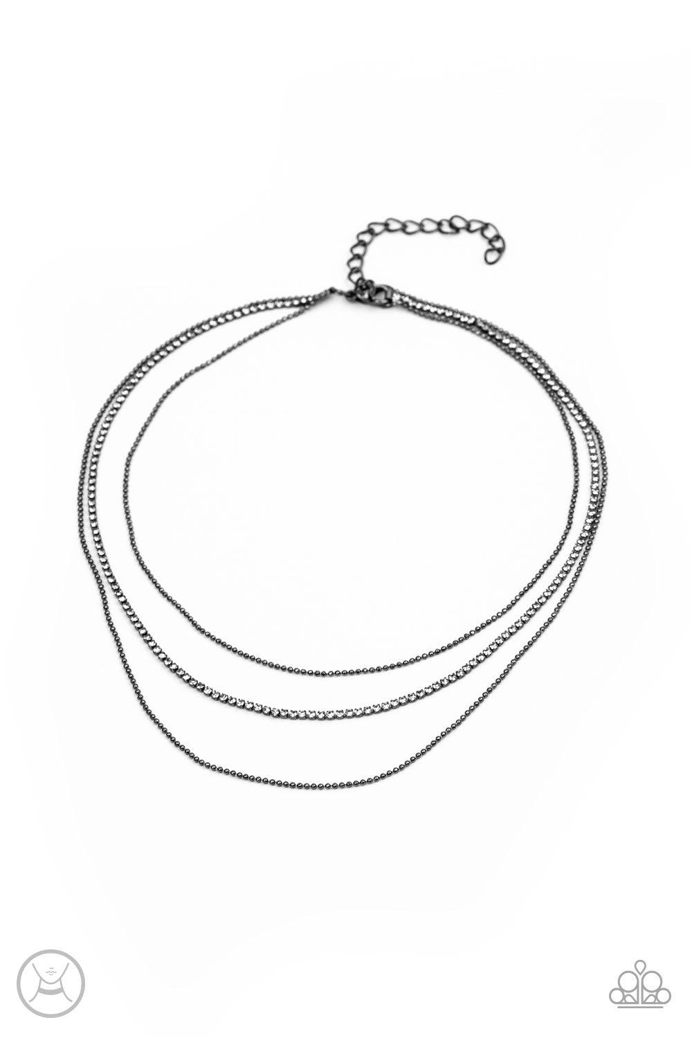 Paparazzi Accessories Battle Of The Glitz - Black Two strands of dainty gunmetal ball chain join a glittery strand of glassy white rhinestones around the neck, creating glittery layers. Features an adjustable clasp closure. Jewelry