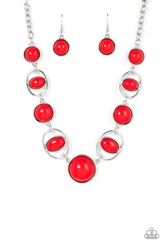 Paparazzi Accessories Eye of the BEAD-holder - Red Encased in sleek silver frames, a bubbly collection of oversized red beads alternate with oval red beaded hoops below the collar for a bodacious pop of color. Features an adjustable clasp closure. Necklac