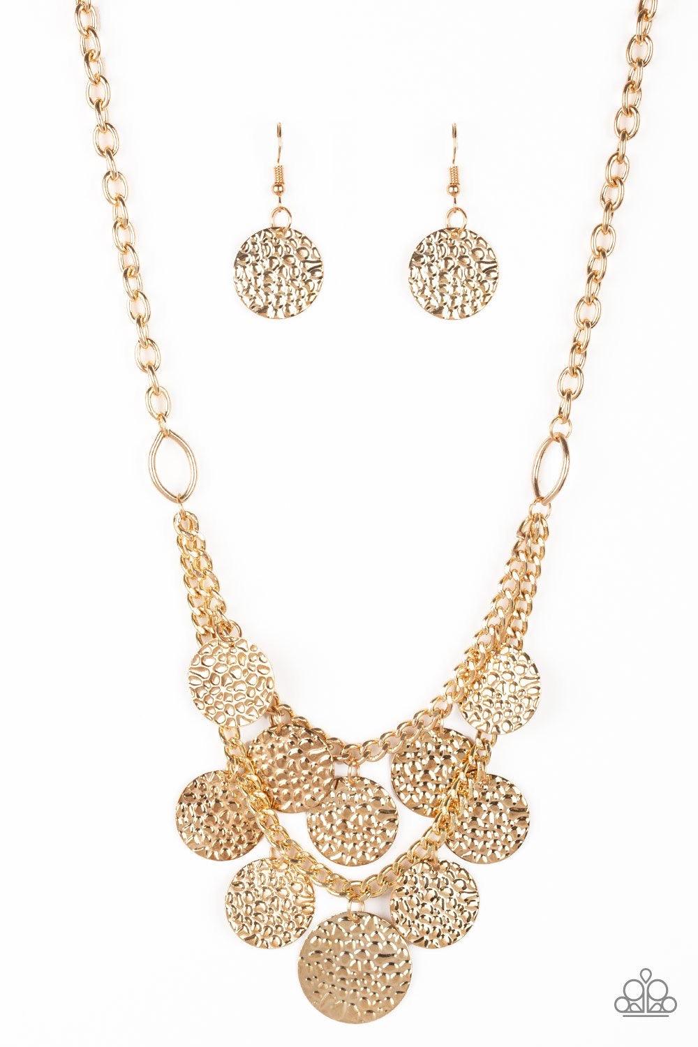 Paparazzi Accessories Work Every CHIME ~Gold Rippling with glistening textures, glistening gold discs dance along two shimmery gold chains, creating an edgy fringe below the collar. Features an adjustable clasp closure. Sold as one individual necklace. In