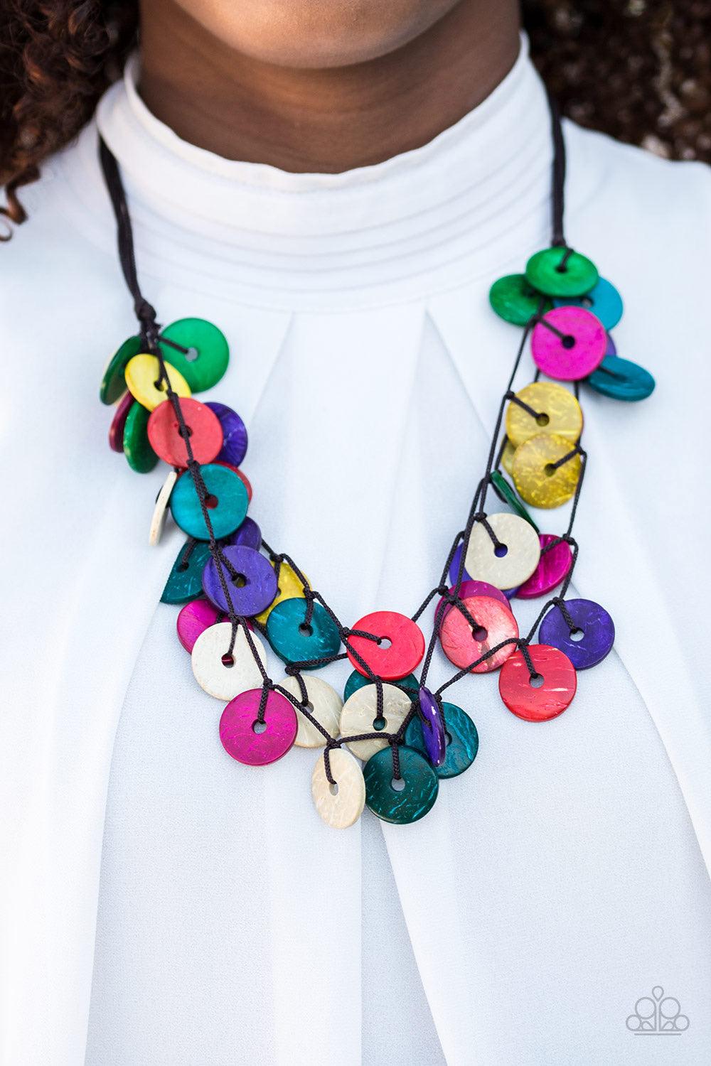 Paparazzi Accessories Jammin in Jamaica - Multi Shiny wooden discs brushed in brightly colored finishes trickle along shiny brown cording, creating clustered layers below the collar. Features a button-loop closure. Sold as one individual necklace. Include