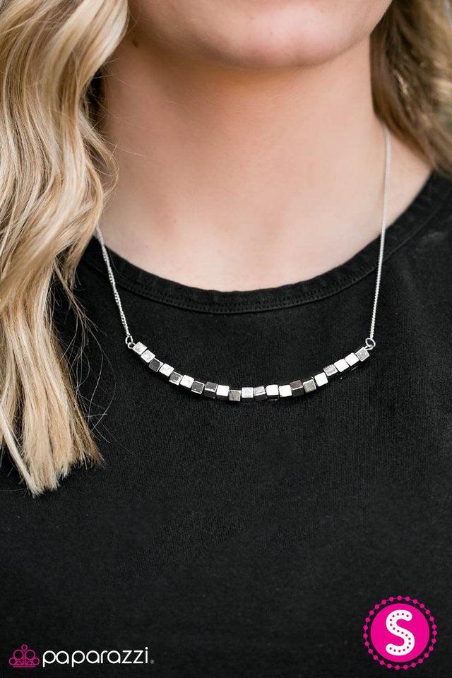 Paparazzi Accessories BoomBox Baby - Silver Glistening cube beading is threaded along a silver wire, creating a versatile pendant below the collar. Infused with a matching silver chain, the edgy cube beading coalesces into a gorgeous tone on tone palette.
