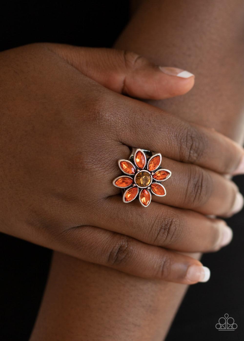 Paparazzi Accessories Prismatic Petals - Orange Orange rhinestone petals bloom from the center of a topaz rhinestone center, creating a sparkling flower atop the finger. Features a stretchy band for a flexible fit. Sold as one individual ring. Jewelry