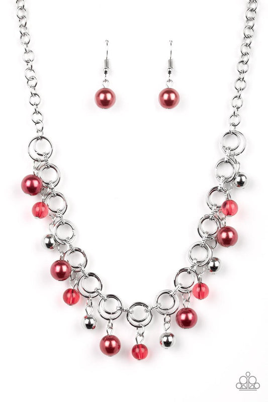 Paparazzi Accessories Fiercely Fancy - Red Featuring pearly and glassy finishes, an array of silver and red beads swing from a double-linked silver chain, creating a fancy fringe below the collar. Features an adjustable clasp closure. Sold as one individu
