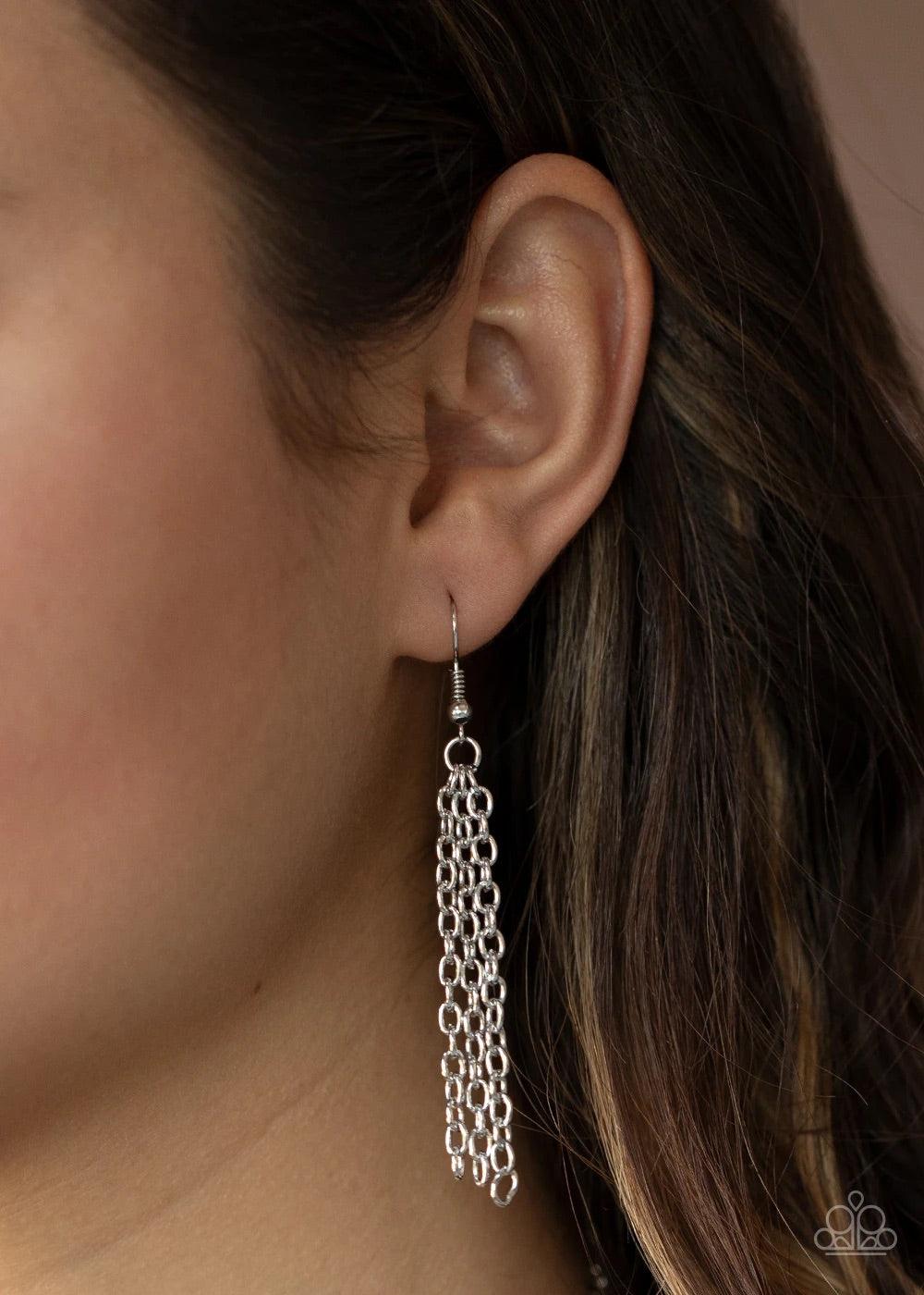 Paparazzi Accessories Circle Back To That - Silver Featuring hammered finishes, two asymmetrical silver rings dangle from the bottom of a lengthened silver chain for a rustic look. A lobster clasp hangs from the bottom of the design to allow a name badge