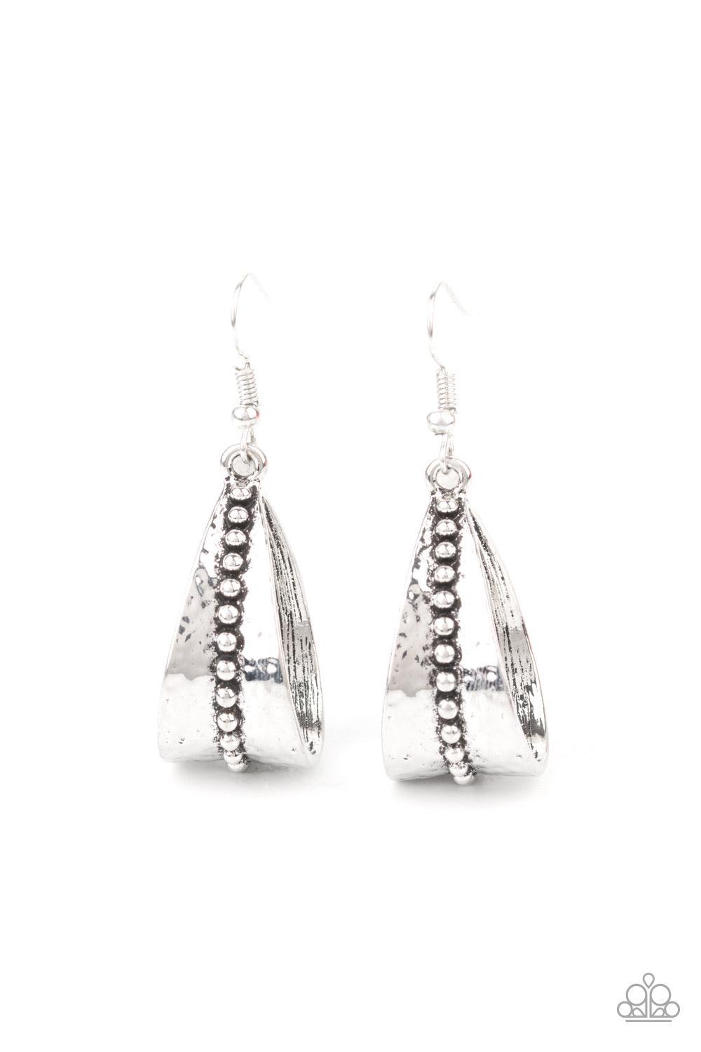 Paparazzi Accessories STIRRUP Some Trouble - Silver A row of antiqued studs dots the center of a hammered silver frame that curls into a rustic teardrop for a seasonal flair. Earring attaches to a standard fishhook fitting. Sold as one pair of earrings. J