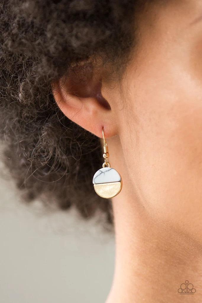 Paparazzi Accessories Rural Reconstruction - Gold Featuring refreshing white stone accents, a trio of gold discs layer down the chest for a seasonal look. Features an adjustable clasp closure. Sold as one individual necklace. Includes one pair of matching