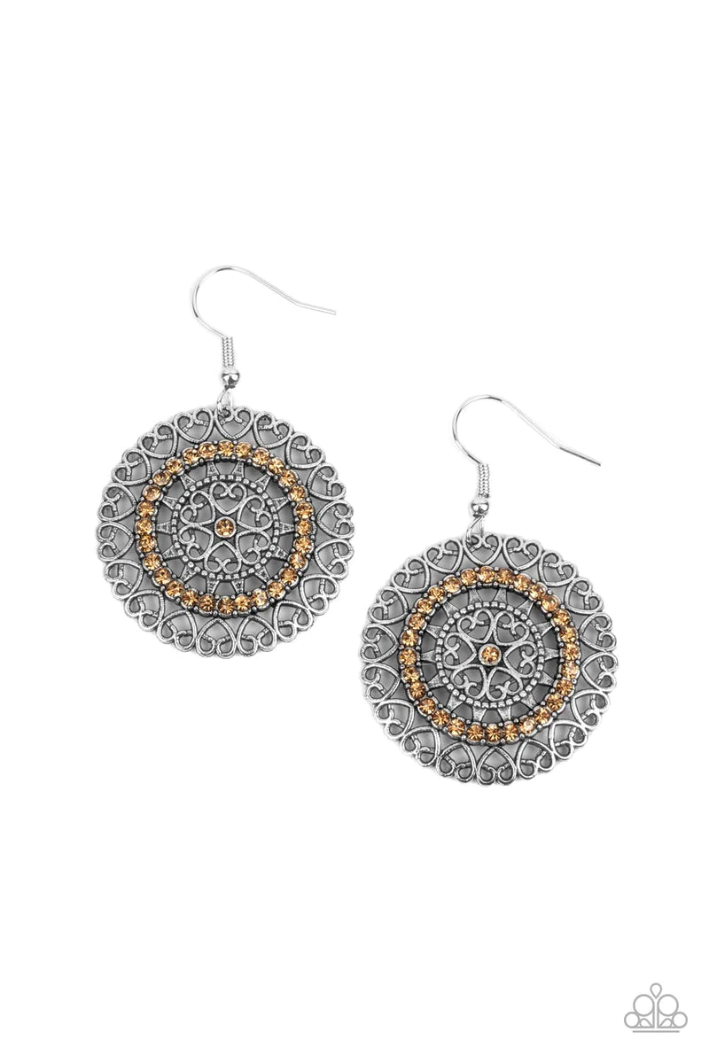 Paparazzi Accessories Fairytale Finale - Brown Silver heart shaped filigree frames spin into an enchanting display. Infused with a ring of glassy topaz rhinestones, the center of the airy frame is dotted with a solitaire topaz rhinestone for a romantic fi