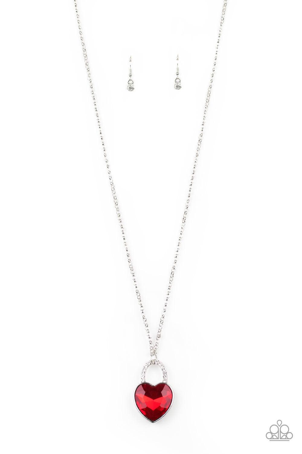 Paparazzi Accessories Locked In Love - Red Chiseled into a charming heart, an oversized red gem is pressed into a silver frame radiating with glassy white rhinestones, creating a glamorous pendant at the bottom of a lengthened silver chain. Features an ad