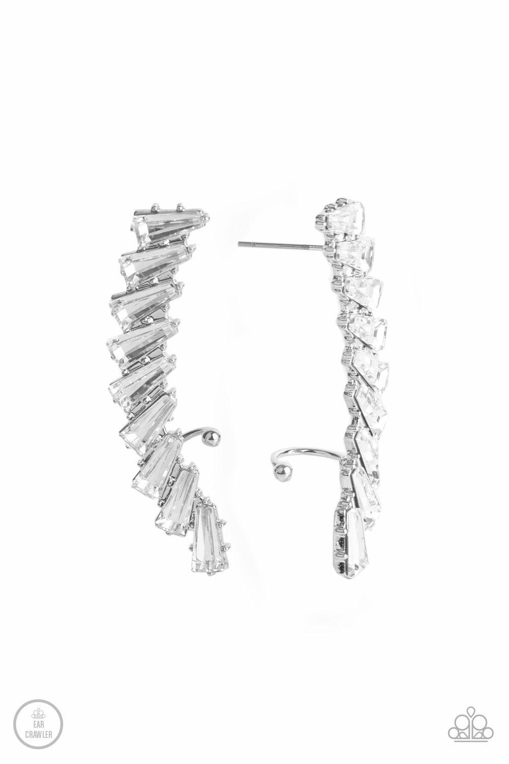Paparazzi Accessories I Think Ice Can - White An icy stack of white rhinestone gems climb the ear, coalescing into a shockingly sparkly frame. Earring attaches to a standard post fitting. Features a dainty cuff attached to the top for a secure fit. Sold a