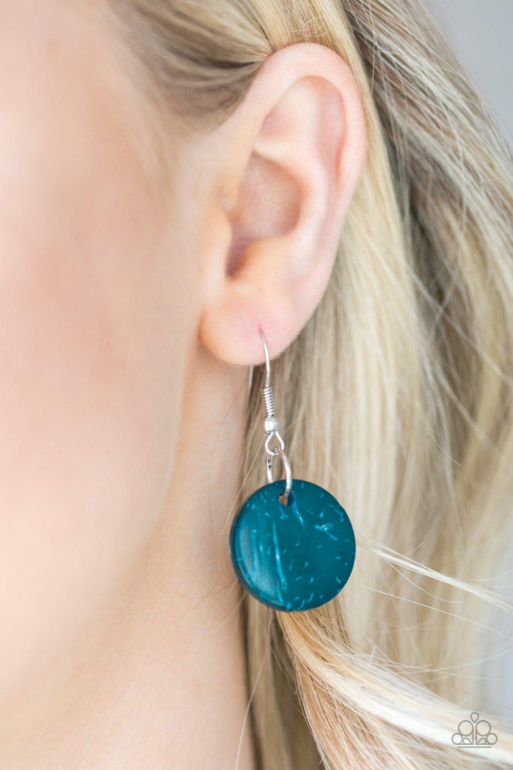 Paparazzi Accessories Pacific Paradise - Blue Featuring abstract geometric finishes, mismatched brown wooden beads and refreshing blue accents are threaded along shiny brown cording. A dramatic geometric bead adorns the center, creating a bold summery loo