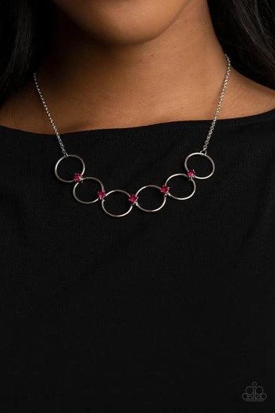 Paparazzi Accessories Regal Society - Pink Glittery pink rhinestones link a dainty row of silver rings below the collar, creating a regal minimalist inspired display. Features an adjustable clasp closure. Sold as one individual necklace. Includes one pair