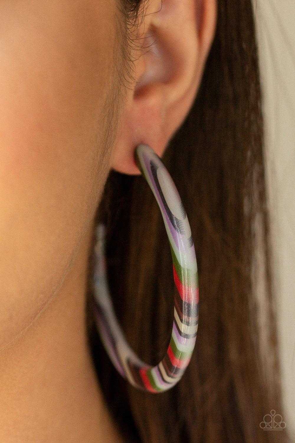 Paparazzi Accessories HAUTE Blooded - Multi Streaked with colorful accents, a striped acrylic hoops curls around the ear for a retro look. Earring attaches to a standard post fitting. Hoop measures approximately 2 1/2" in diameter.Sold as one pair of hoop