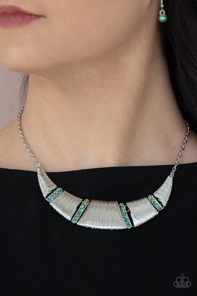 Paparazzi Accessories Going Through Phases - Multi Embossed in linear textures, trapezoidal and triangular silver plates delicately link with dainty iridescent metallic rhinestone encrusted frames, creating a dramatic half moon below the collar. Features