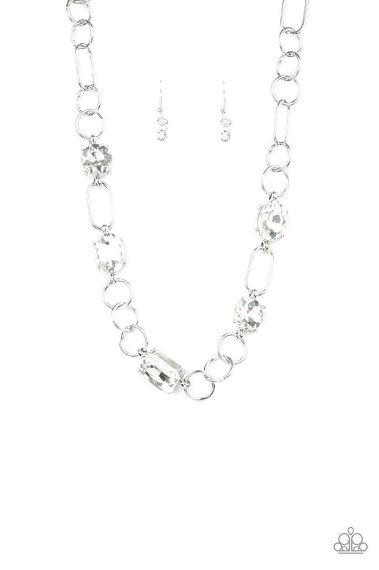 Paparazzi Accessories Urban District - White Featuring round, oval, and emerald style cuts, glittery white rhinestone fittings link with mismatched silver rings below the collar for an edgy glamorous look. Features an adjustable clasp closure. Sold as one