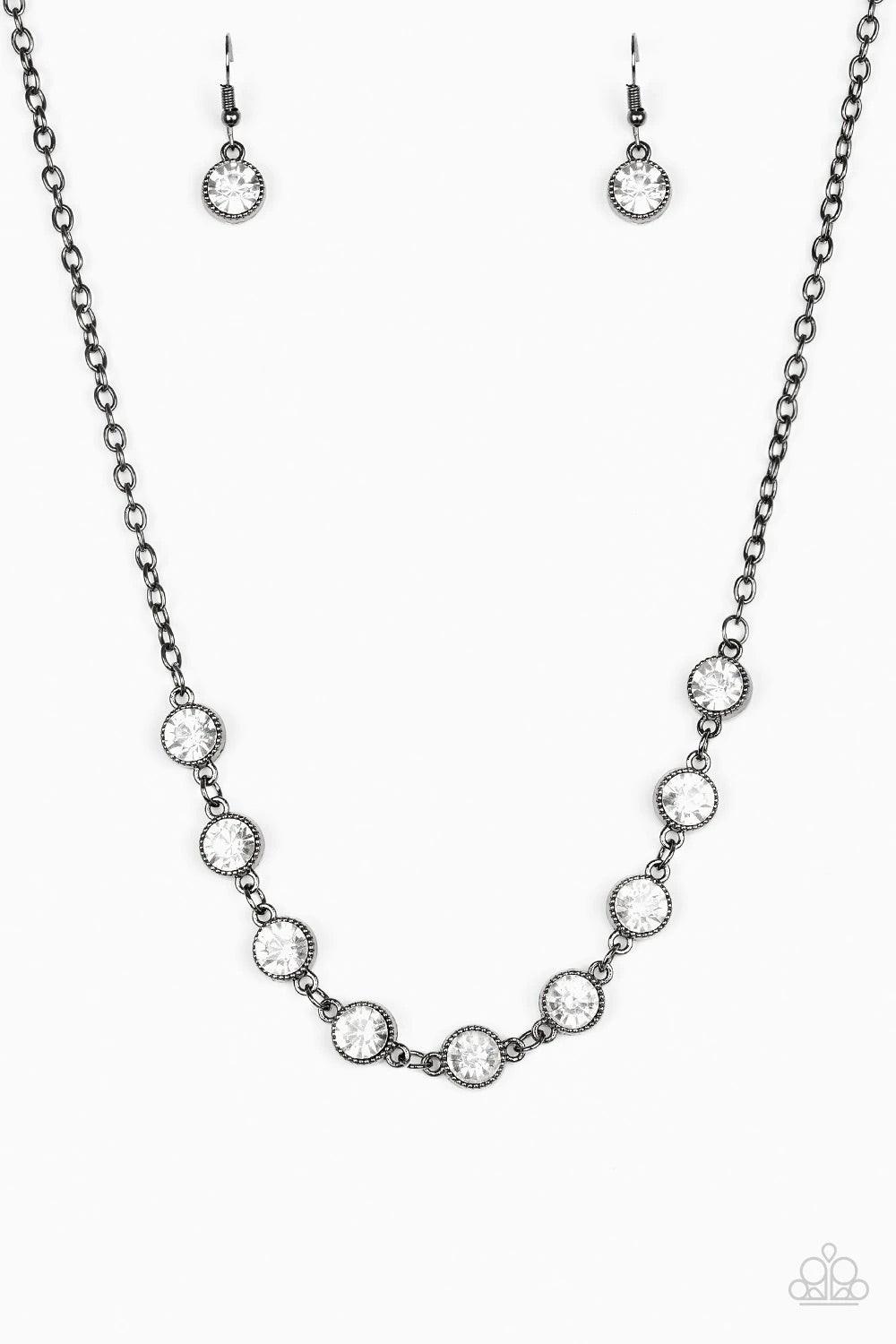 Paparazzi Accessories Starlit Socials - Black Encased in studded gunmetal frames, glittery white rhinestones link below the collar for a glamorous look. Features an adjustable clasp closure. Sold as one individual necklace. Includes one pair of matching e