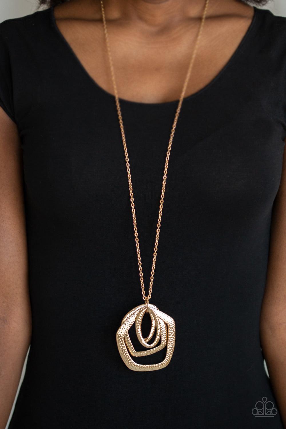 Paparazzi Accessories Urban Artisan ~Gold A collection of hammered geometric frames swing from the bottom of a lengthened gold chain, creating a bold artisan inspired pendant. Features an adjustable clasp closure. Sold as one individual necklace. Includes
