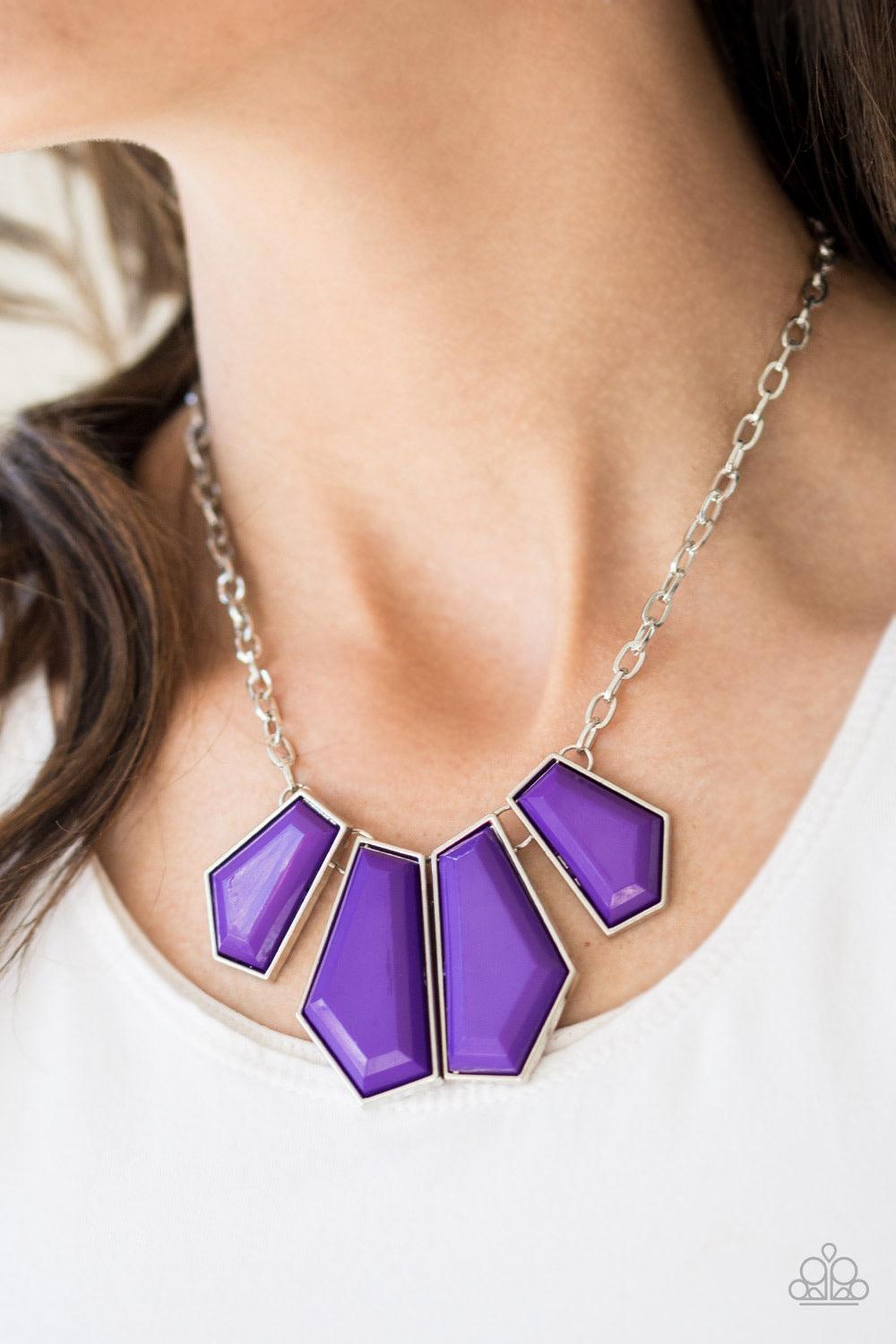 Paparazzi Accessories Get Up and Geo - Purple Featuring emerald-style cuts, faceted purple beads are pressed into sleek silver frames. The colorful frames join at the bottom of a shimmery silver chain, creating a bold geometric fringe below the collar. Fe
