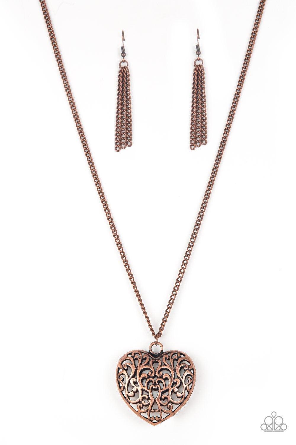 Paparazzi Accessories Victorian Virtue ~Copper Antiqued vine-like filigree climbs the front and back of a heart-shaped pendant, creating a dramatic 3-dimensional pendant. The vintage inspired pendant swings from the bottom of a lengthened copper chain for