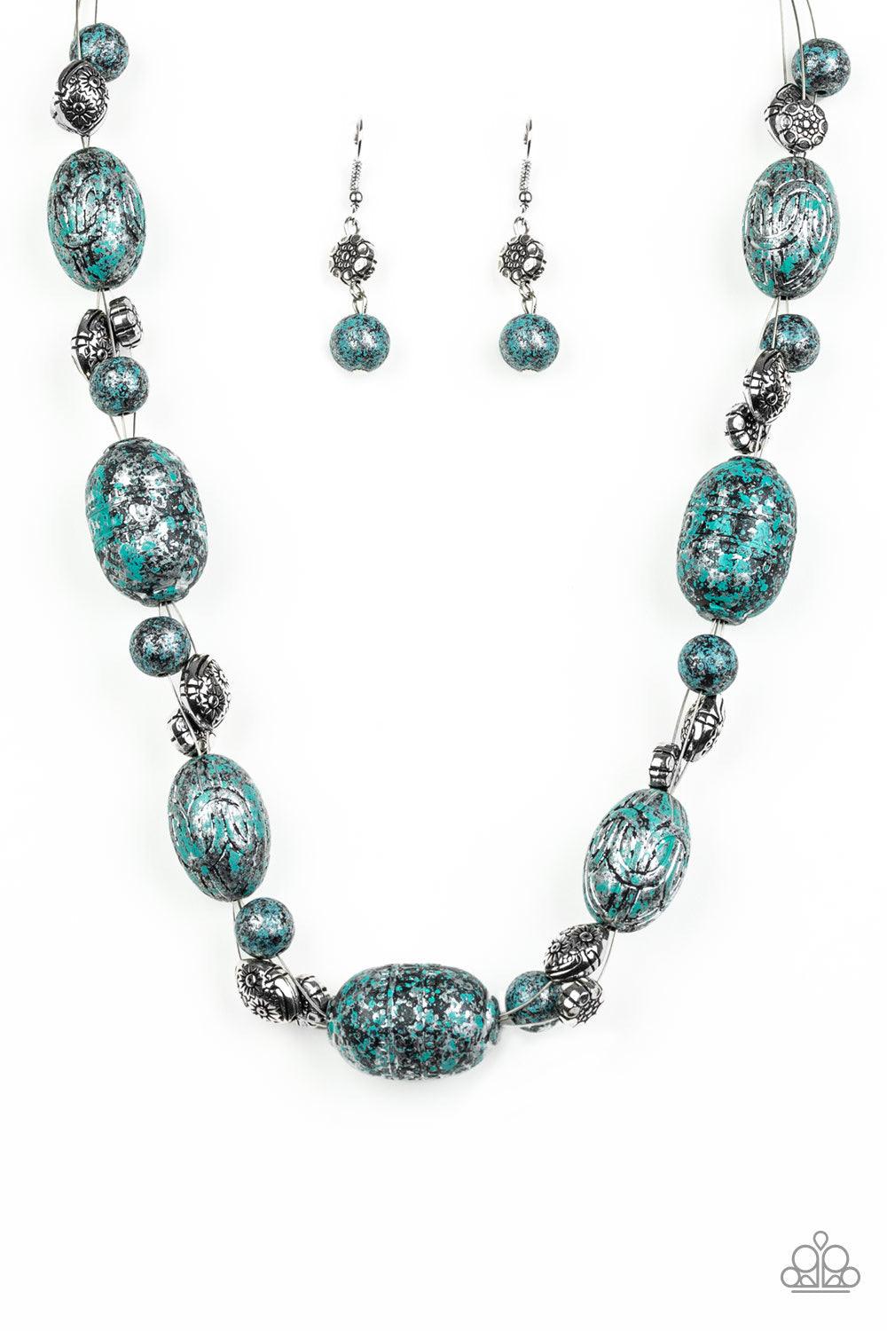 Paparazzi Accessories Gatherer Glamour - Blue Featuring a silvery patina finish, a collection of ornate beads and an array of floral stamped silver beads are threaded along invisible wire below the collar for a seasonal flair. Features an adjustable clasp