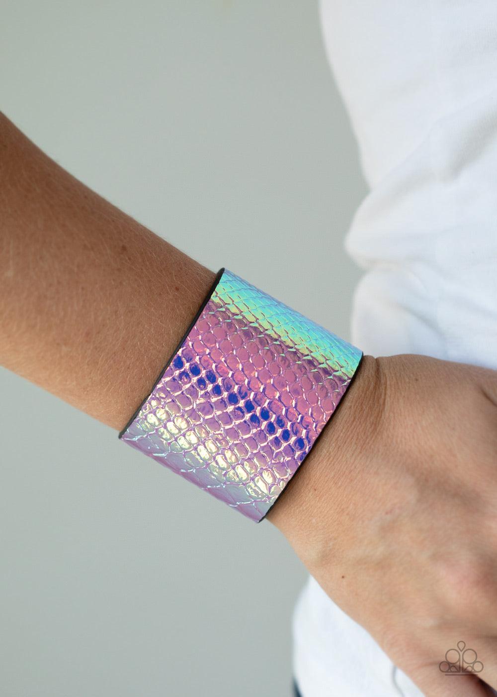 Paparazzi Accessories Galactic Galapagos - Pink Featuring an iridescent crocodile pattern, a metallic pink leather band wraps around the wrist for a retro look. Features an adjustable snap closure. Sold as one individual bracelet. Jewelry