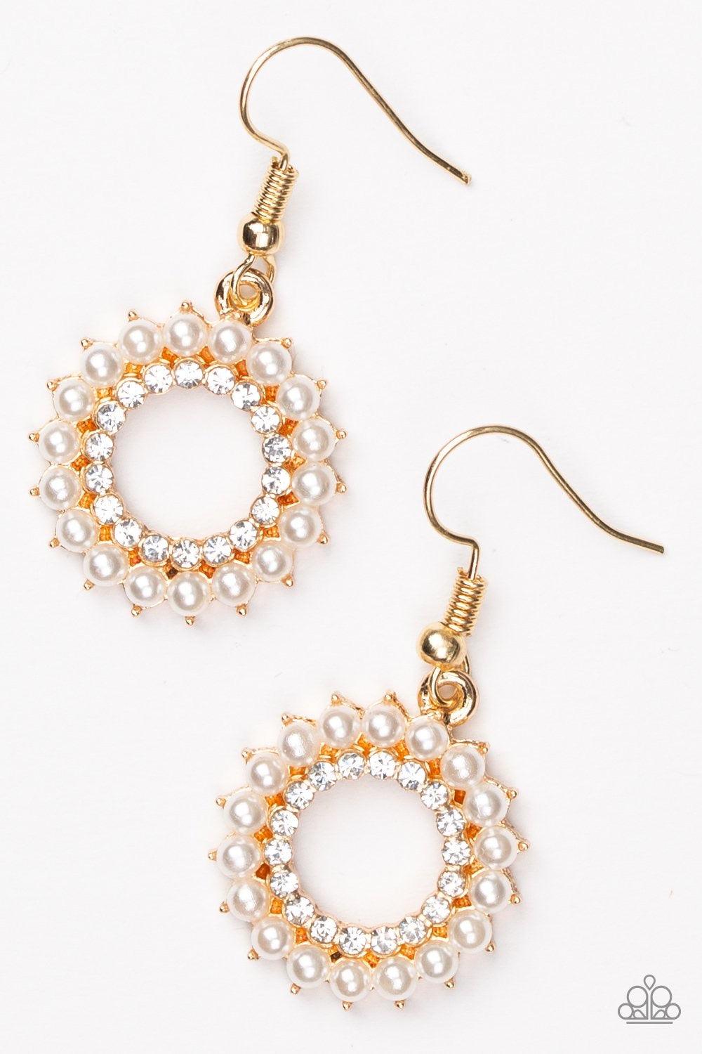 Paparazzi Accessories A Proper Lady - Gold Dainty white pearls circle around a ring of radiant white rhinestones, creating an elegant frame. Earring attaches to a standard fishhook fitting. Jewelry