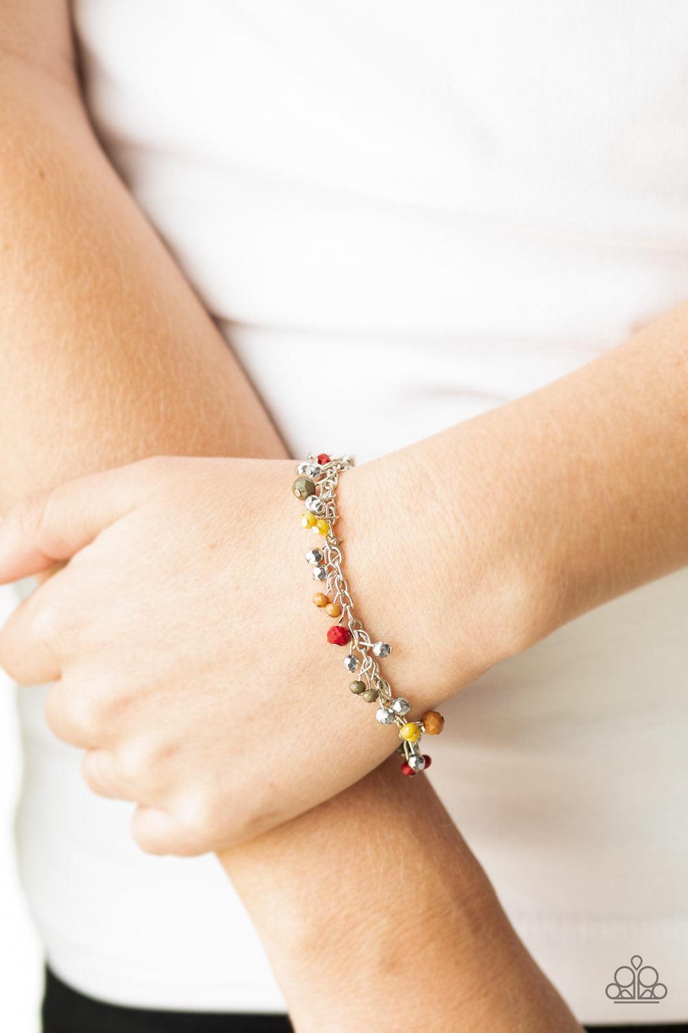 Paparazzi Accessories Aquatic Adventure - Multi A variety of faceted multicolored beads swing from a shimmery silver chain, creating a flirtatious fringe around the wrist. Faceted silver beads trickle between the colorful beads, adding a hint of shimmer t