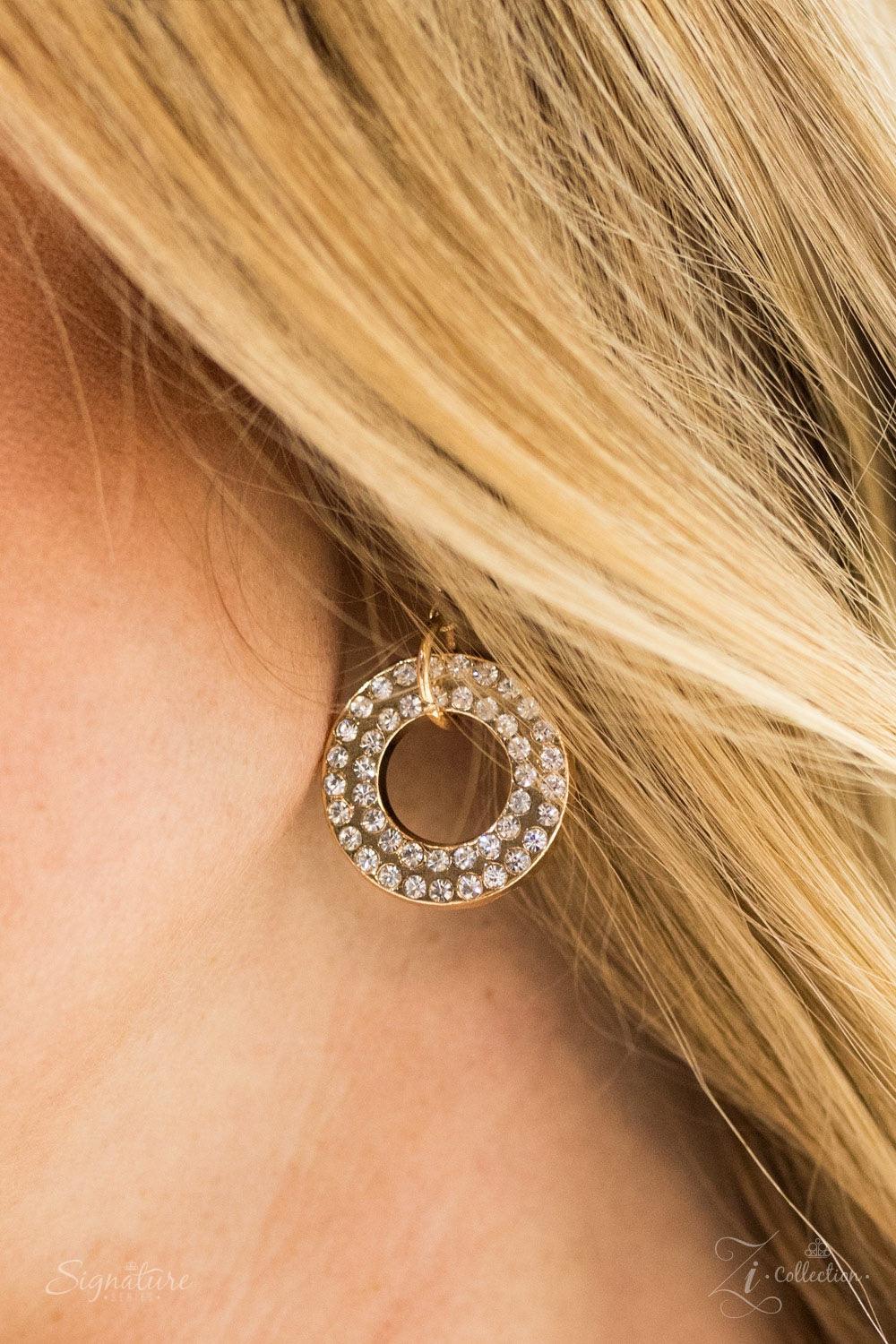 Paparazzi Accessories The Melissa Encrusted in glittery white rhinestones, glistening gold frames give way to layers of shimmery gold chains. Varying in size and shimmer, the bold assortment of gold chains drape across the chest in a fierce and flawless f
