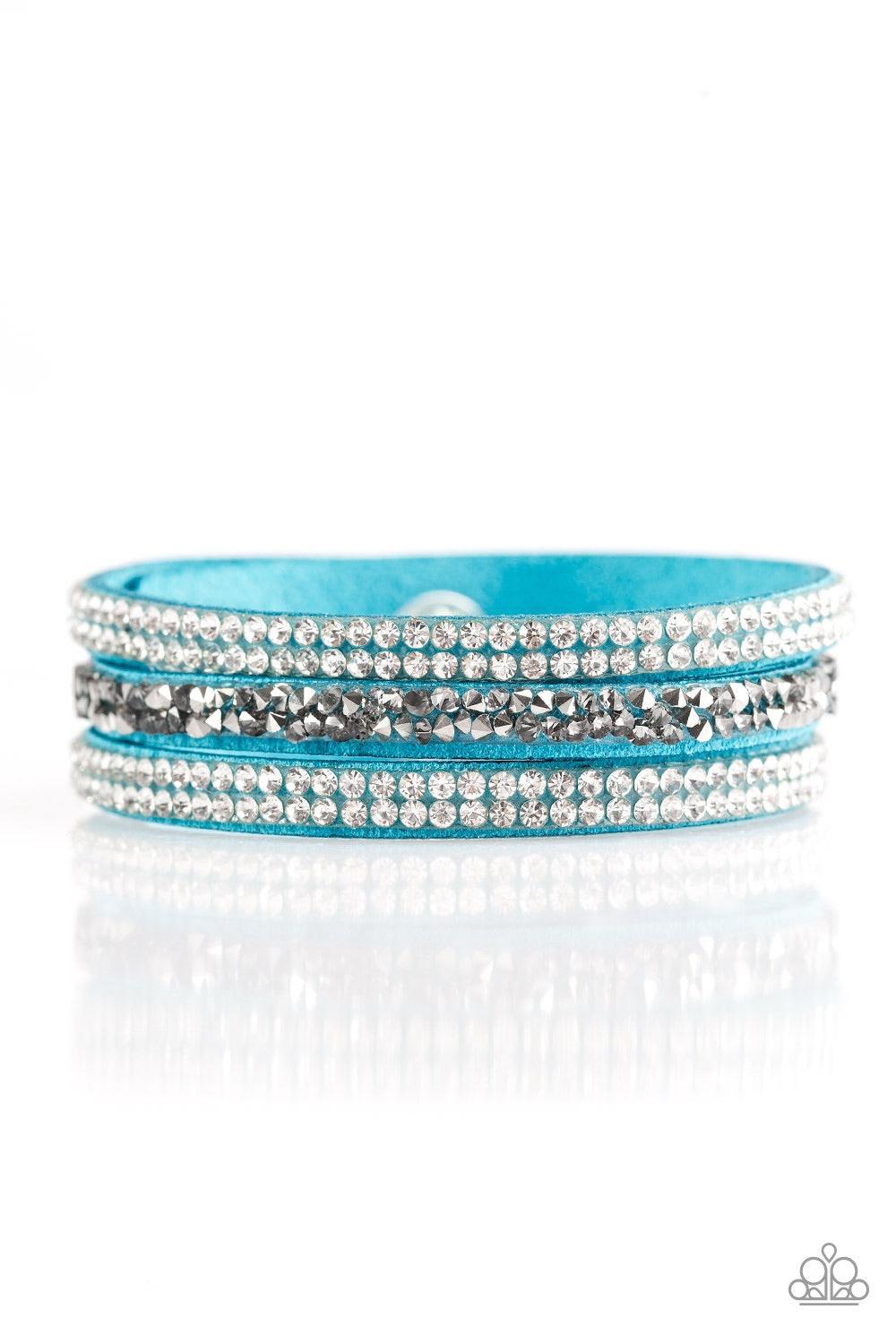 Paparazzi Accessories Mega Glam - Blue Glittery white, smoky, and glassy hematite rhinestones are sprinkled along three strands of refreshing blue suede for a glamorous look. Features an adjustable snap closure. Jewelry