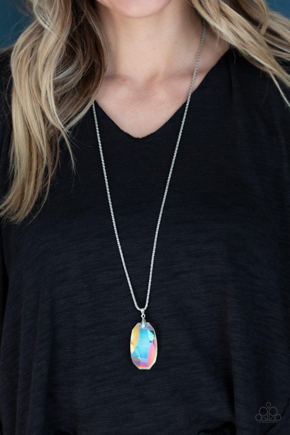Paparazzi Accessories Gemstone Grandeur - Multi Featuring a raw cut and metallic backing, an iridescent gem swings from the bottom of an elongated silver popcorn chain. Dotted with a dainty white rhinestone, the faceted gem catches and refracts the light