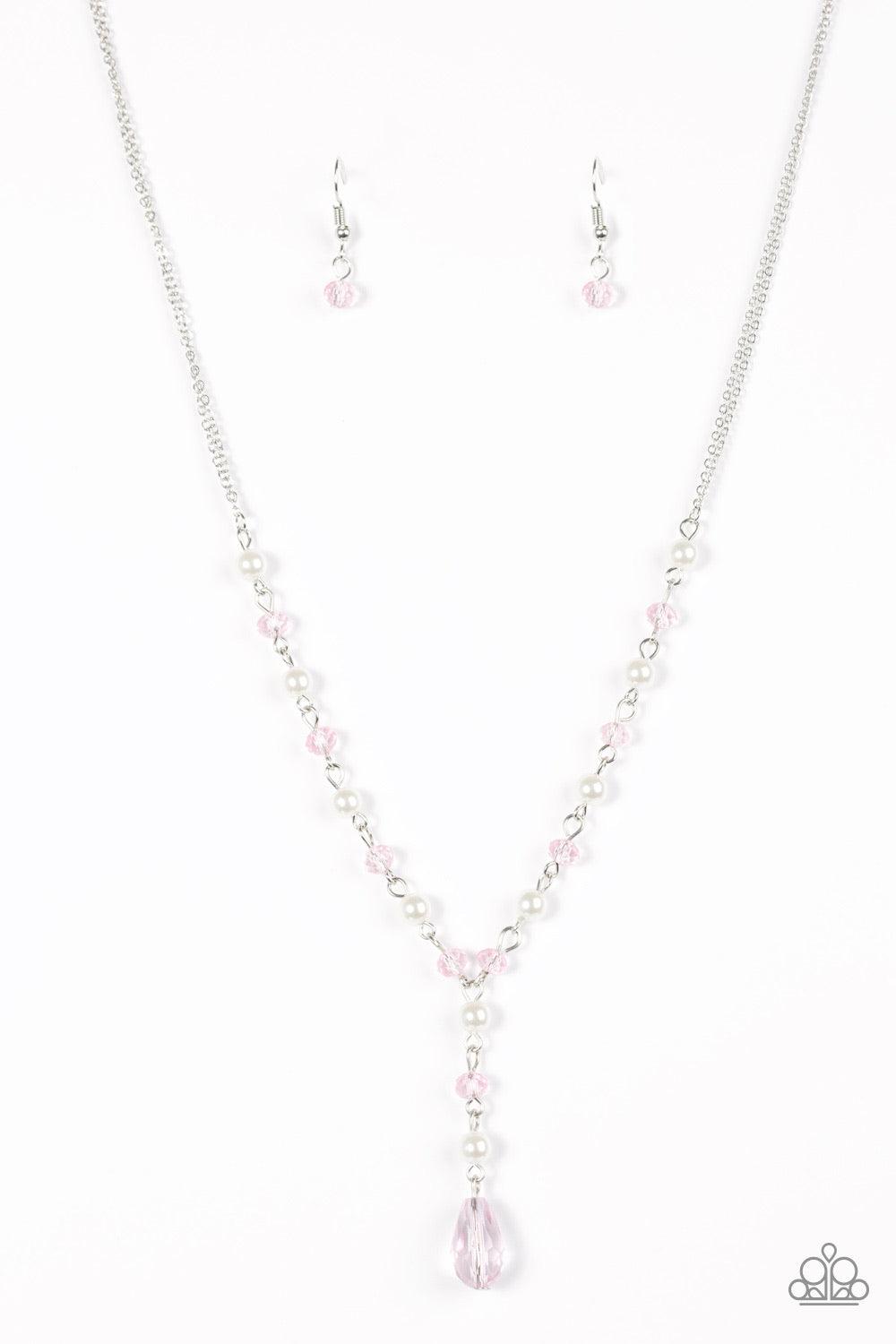 Paparazzi Accessories Diva Deluxe - Pink Dainty white pearls alternate with pink crystal-like beading along a silver chain. An extension of pearls and crystal beading cascades from the chain, giving way to a dramatic teardrop pendant for a vintage inspire