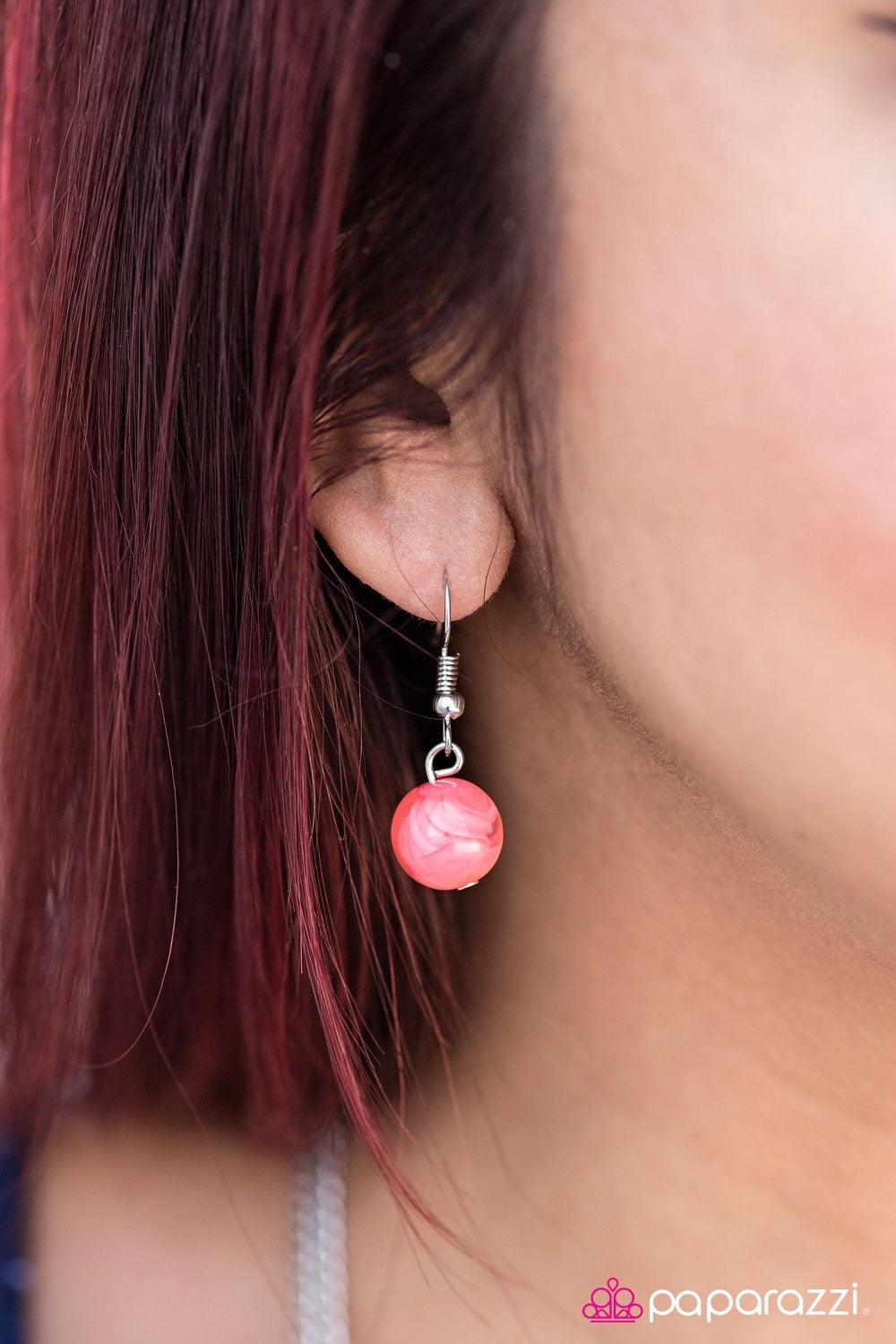 Paparazzi Accessories Have An Ice Day - Orange Featuring smooth and glassy faceted finishes, smoky orange beads join silver hoops along a shimmery silver chain, creating an icy palette. Two silver accents give way to trestles of mixed chain, adding an ind