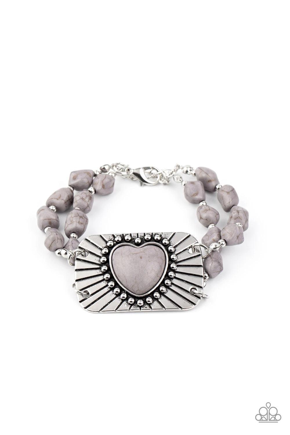 Paparazzi Accessories Sandstone Sweetheart - Silver Threaded along invisible wire, strands of gray rock beads and dainty silver accents attach to a shimmery silver plate radiating with linear and studded textures. Chiseled into a charming heart, a gray st