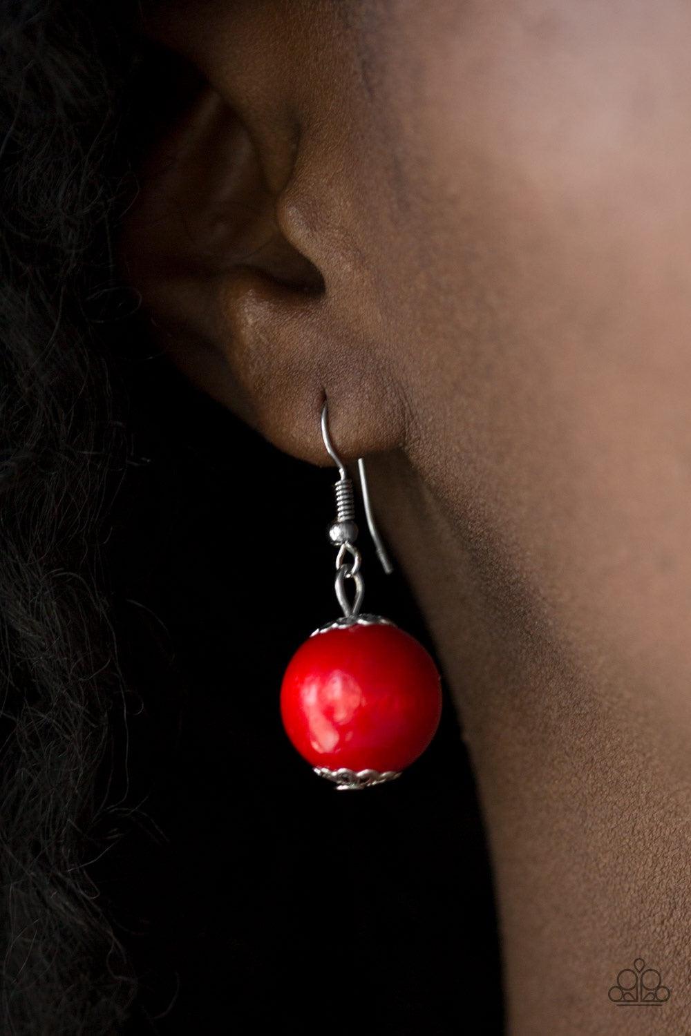Paparazzi Accessories Caribbean Cover Girl - Red Brushed in a distressed finish, fiery red wooden beads and discs join below the collar for a summery look. Features a button loop closure. Jewelry