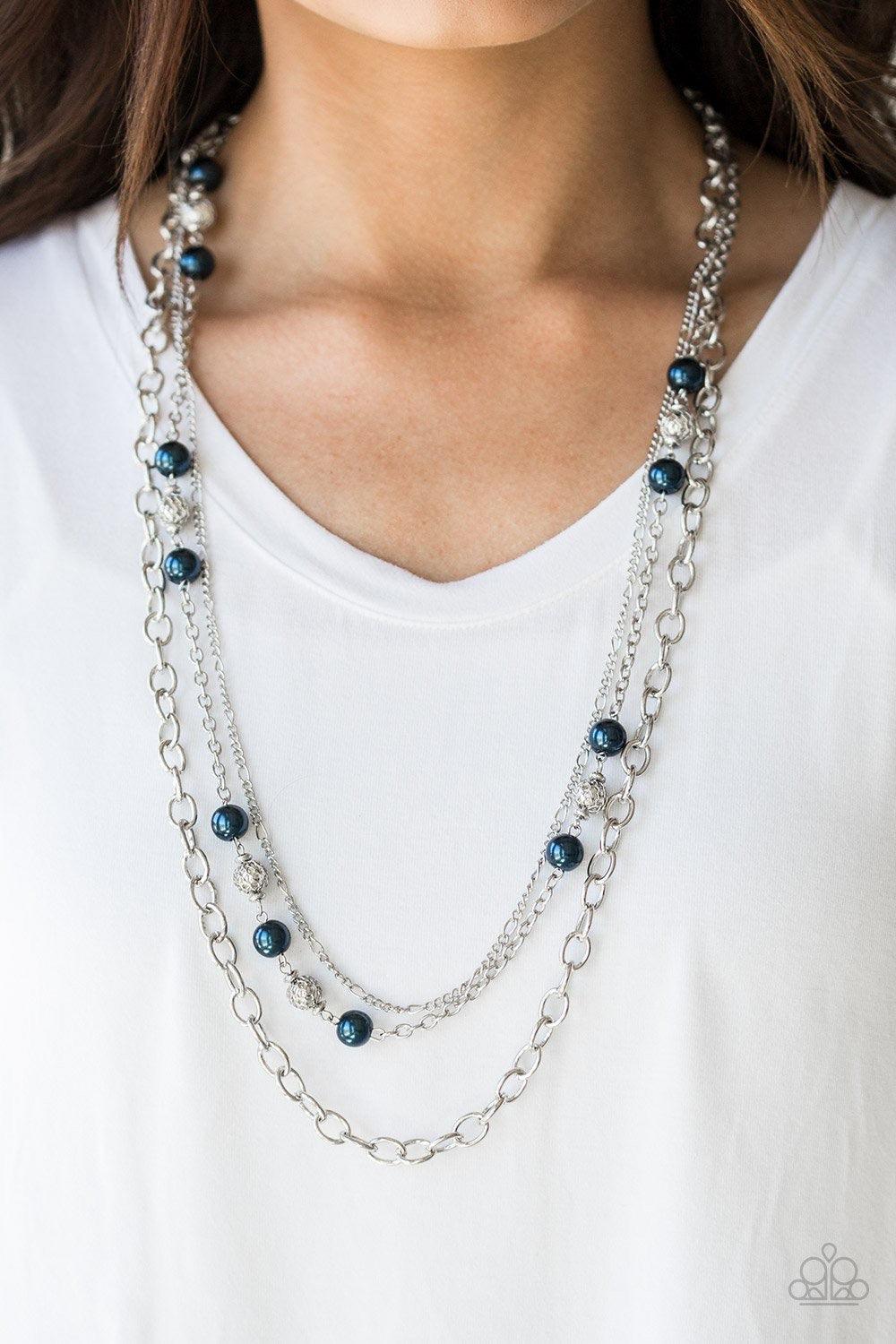 Paparazzi Accessories Classical Cadence - Blue Wrapped in wire mesh, classic silver beads join pearly blue beads along a shimmery silver chain. Varying in size and shimmer, mismatched silver chains layer behind the beaded strand for a refined finish. Feat