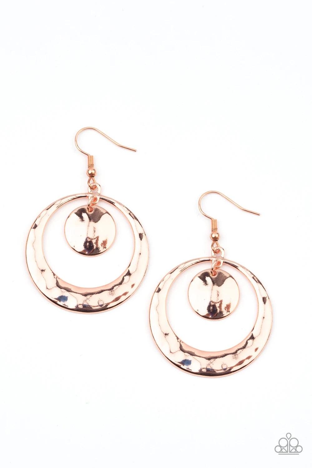 Paparazzi Accessories Rounded Radiance - Copper A hammered shiny copper disc swings from the top of a hammered shiny copper hoop that widens at the bottom, creating a radiant lure. Earring attaches to a standard fishhook fitting.Sold as one pair of earrin