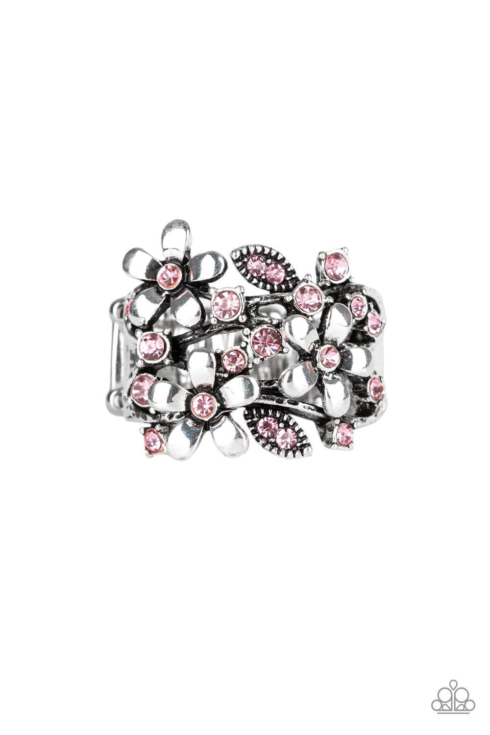 Paparazzi Accessories Gardenia Gleam - Pink Dotted with glittery pink rhinestones, a trio of shimmery silver flowers bloom across the finger, coalescing into a whimsical band. Features a stretchy band for a flexible fit. Jewelry