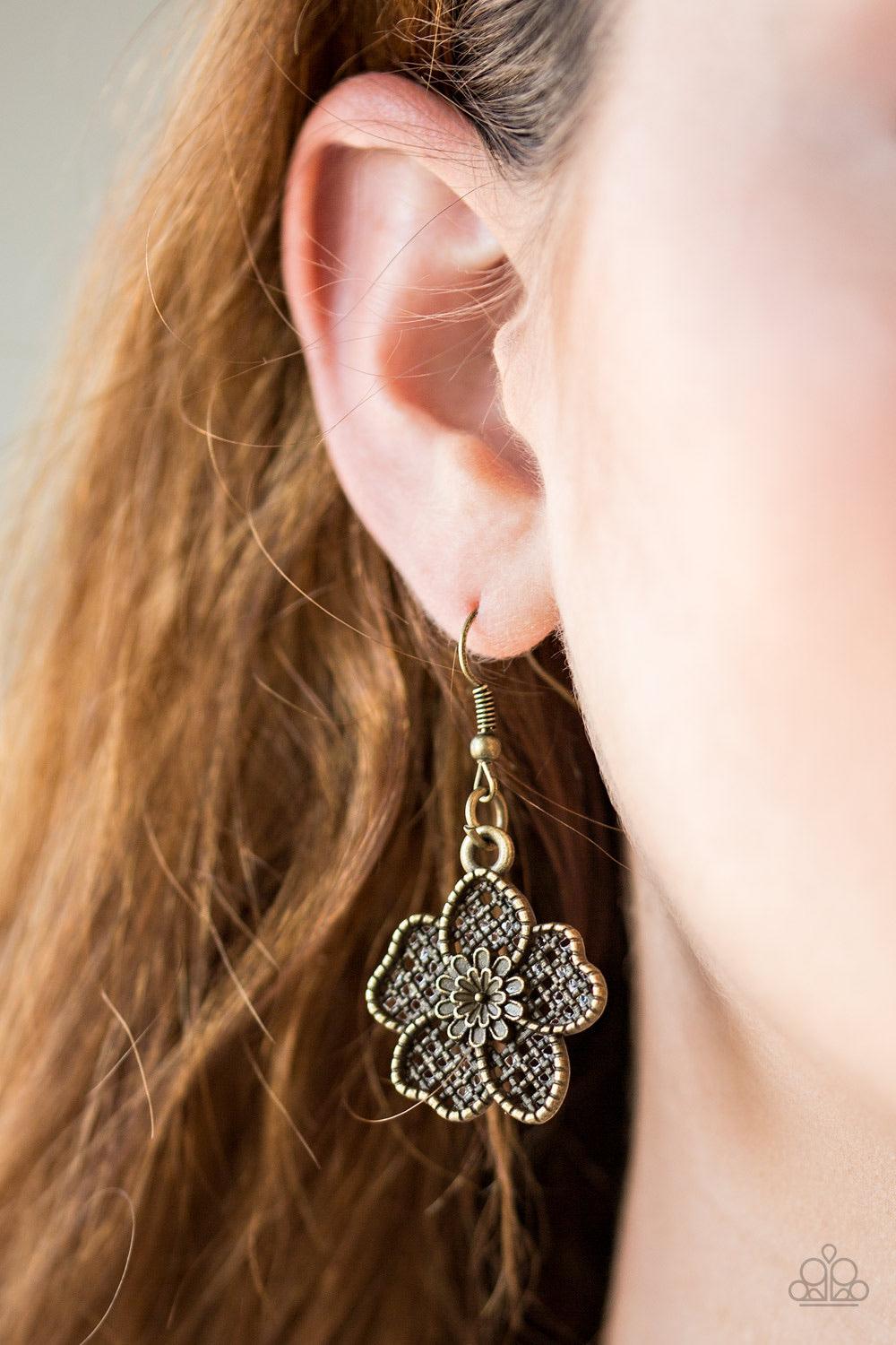 Paparazzi Accessories Petunia Paradise - Brass Featuring lattice-like patterns, shimmery brass flowers bloom below the collar for a seasonal look. Features an adjustable clasp closure. Sold as one individual necklace. Includes one pair of matching earring