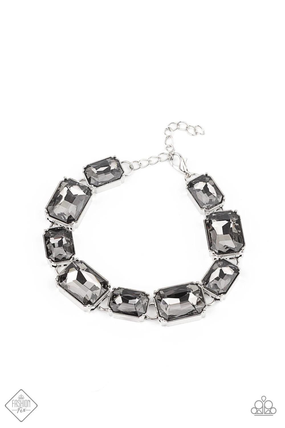 Paparazzi Accessories After Hours - Silver Encased in sleek silver fittings and varying in size, a regal chain of smoky emerald-cut gems wraps around the wrist for a timeless finish. Features an adjustable clasp closure. Sold as one individual bracelet. J