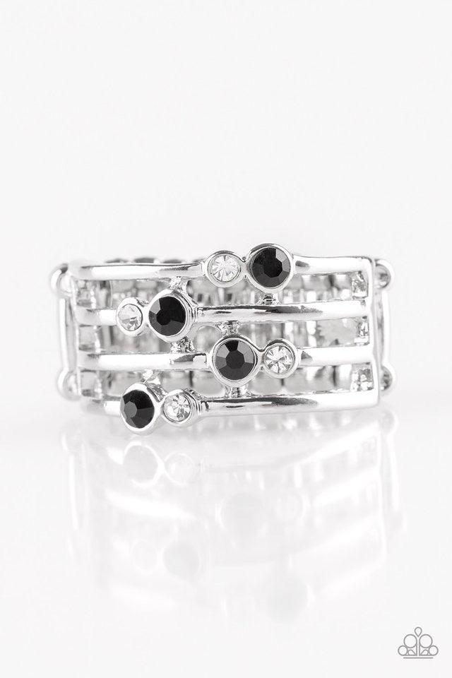 Paparazzi Accessories Sparkle Showdown - Black Glittery black and white rhinestones are scattered along arcing silver bands, coalescing into a refined frame. Features a stretchy band for a flexible fit. Sold as one individual ring. Jewelry