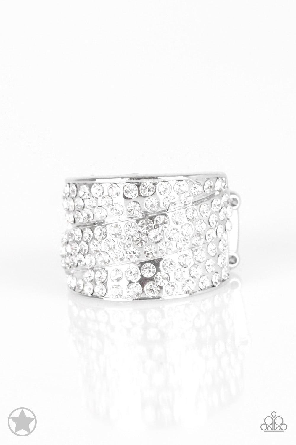 Paparazzi Accessories The Millionaires Club - White Row upon row of glistening white rhinestones stack into an incandescent display. An additional row of sparkling rhinestones wraps diagonally across the band for an extra splash of refined shimmer. Featur