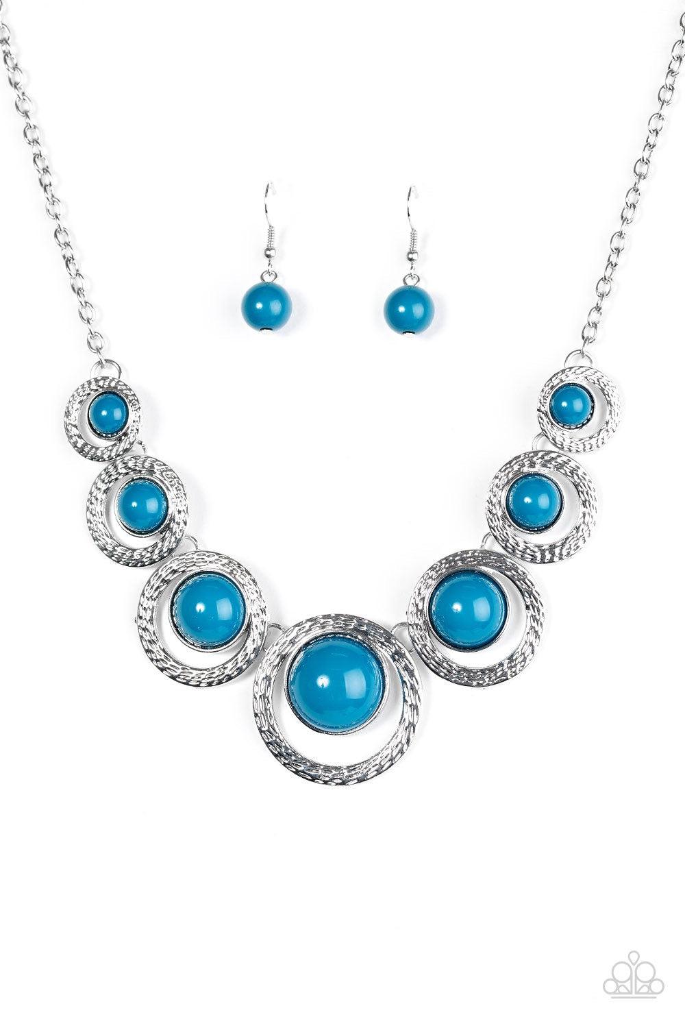 Paparazzi Accessories Jungle River - Blue Refreshing blue beads are pressed into the centers of delicately hammered silver frames, creating colorful accents below the collar. The shiny blue beads gradually increase in size as they near the center, adding