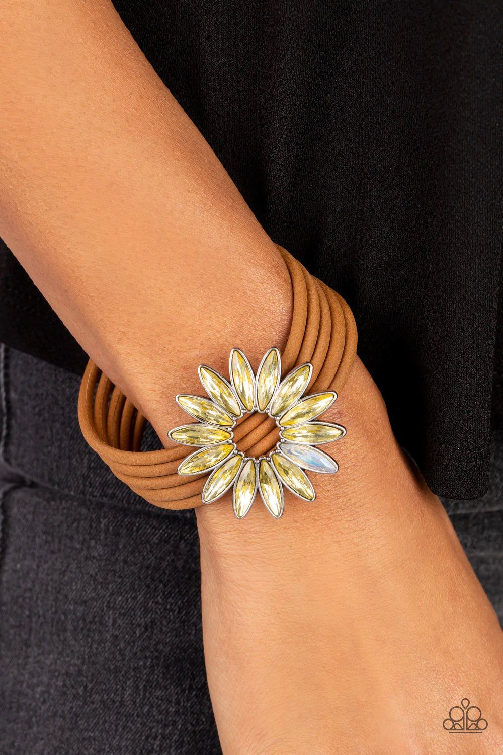 Paparazzi Accessories Astral Adventure - Yellow Row after row of brown suede cords layer around the wrist. Featuring oblong marquise style cuts, a collection of yellow and iridescent rhinestones fans out into a circular focal point, resulting in a celesti