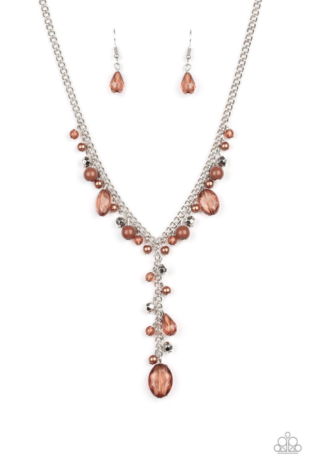 Paparazzi Accessories Crystal Couture - Brown Mismatched polished brown beads, crystal-like beads, and faceted silver beads dance along a shimmery silver chain. Matching beading trickles along a single silver chain, creating a romantic extended pendant be