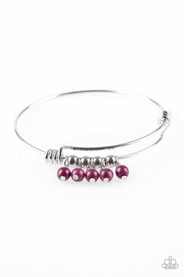 Paparazzi Accessories All Roads Lead To ROAM - Purple Silver wire coils around the wrist, creating an adjustable-like bangle. Glassy purple beads slide between two wire wrap fittings, creating colorful accents along the wrist. Jewelry