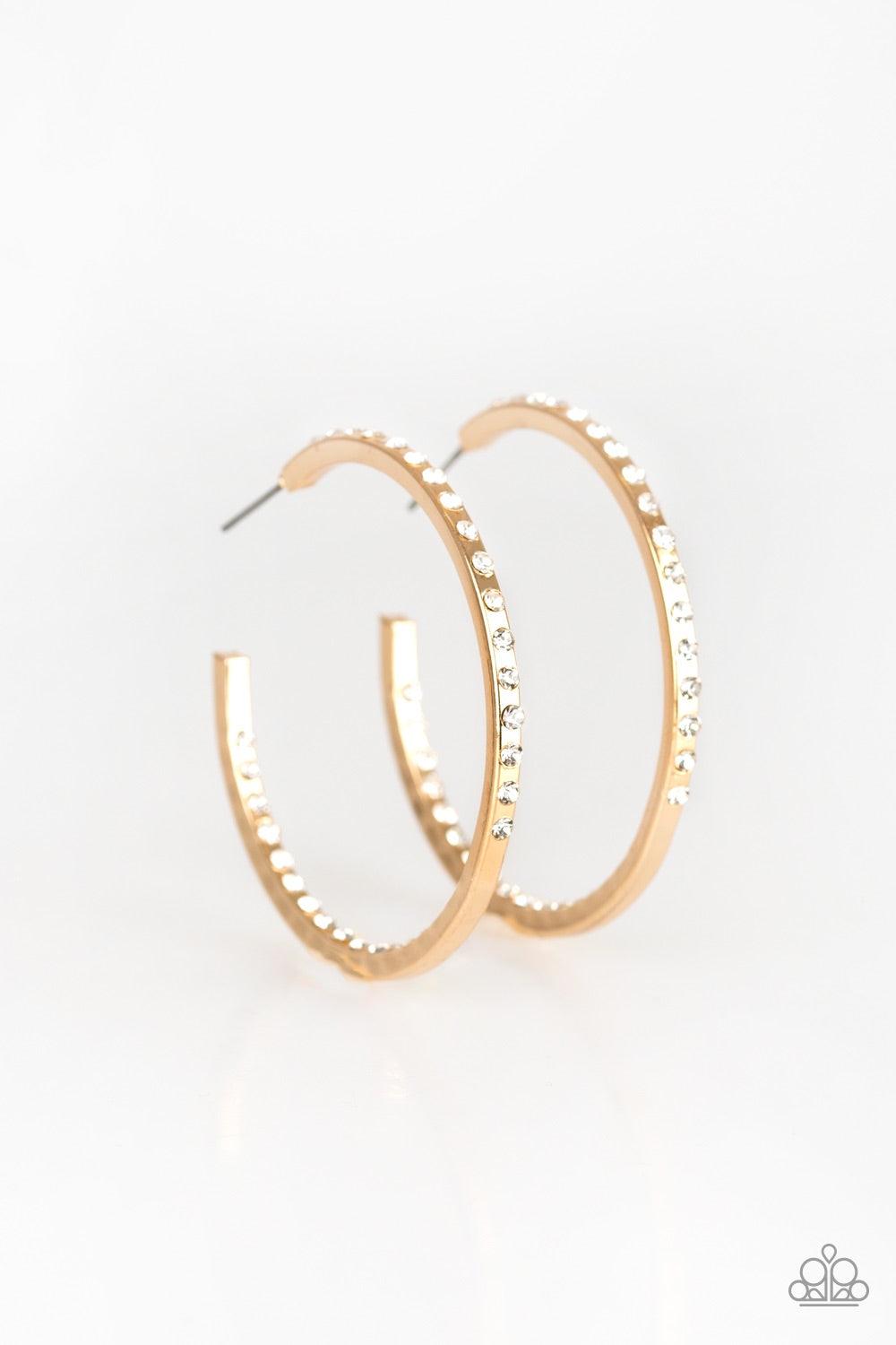 Paparazzi Accessories Comin Into Money - Gold The front half and inner backside of a sleek gold hoop is encrusted in glassy white rhinestones, easily catching and reflecting the light for an extra dash of shimmer. Earring attaches to a standard post fitti