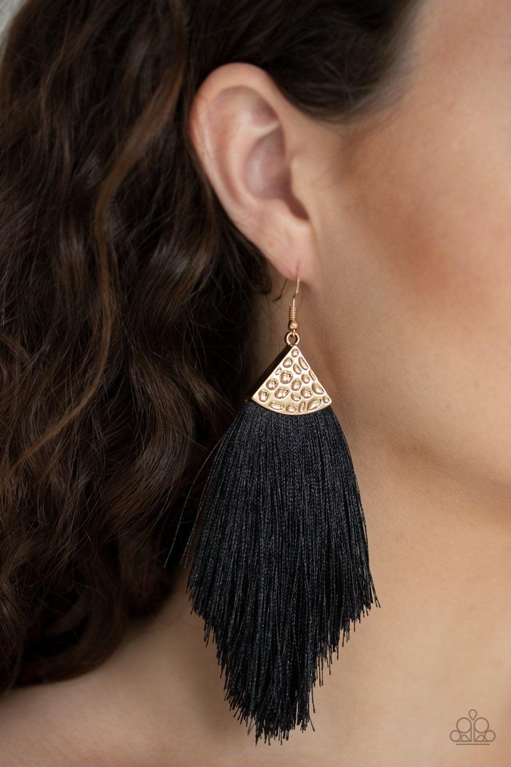 Paparazzi Accessories Tassel Tempo - Black Shiny black thread fans out from the bottom of a hammered gold fitting, creating a tapered fringe. Earring attaches to a standard fishhook fitting. Jewelry