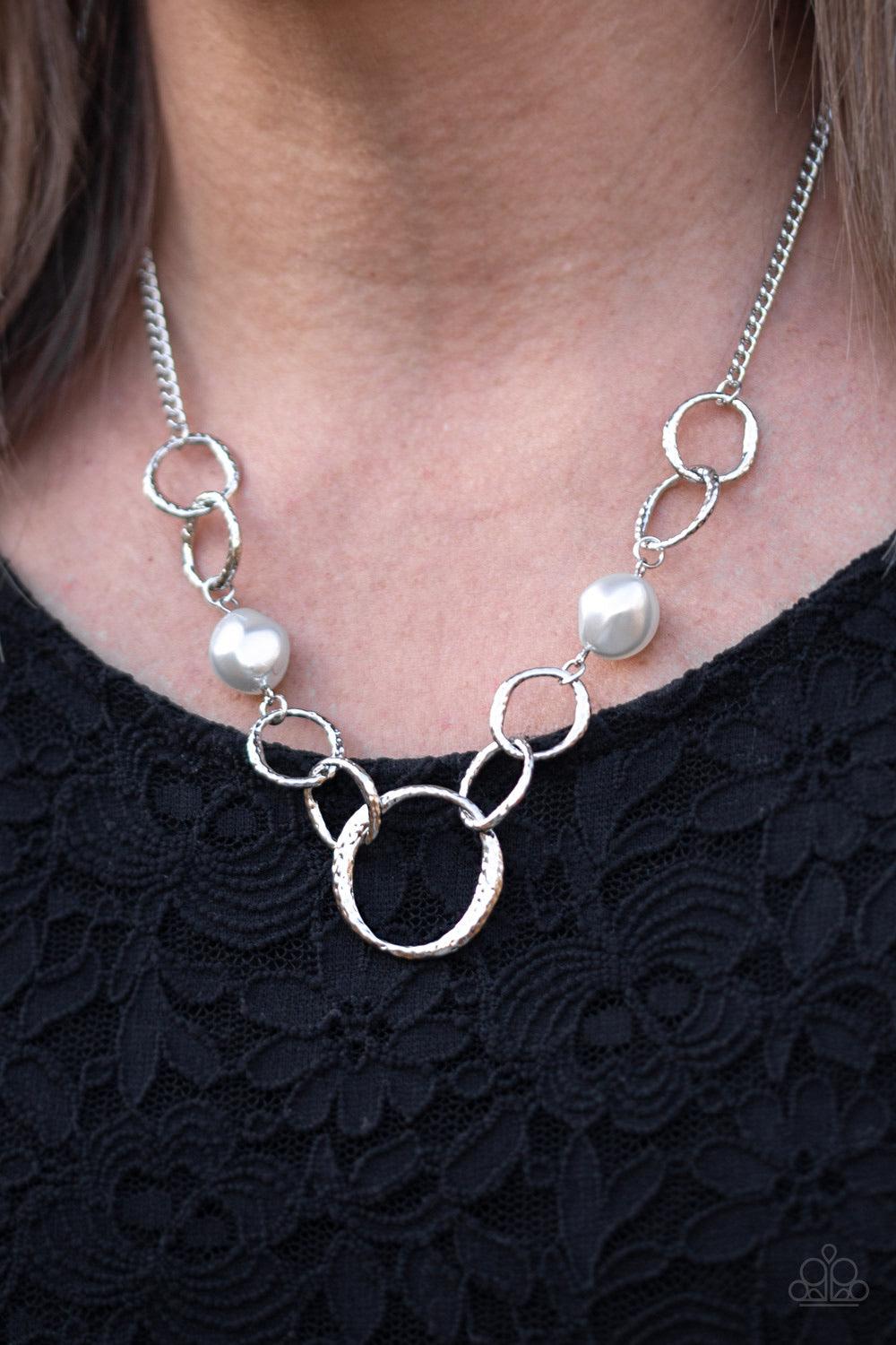 Paparazzi Accessories Lead Role - Silver Pearly silver pebbles join with delicately hammered silver rings below the collar for a refined flair. Features an adjustable clasp closure. Sold as one individual necklace. Includes one pair of matching earrings.